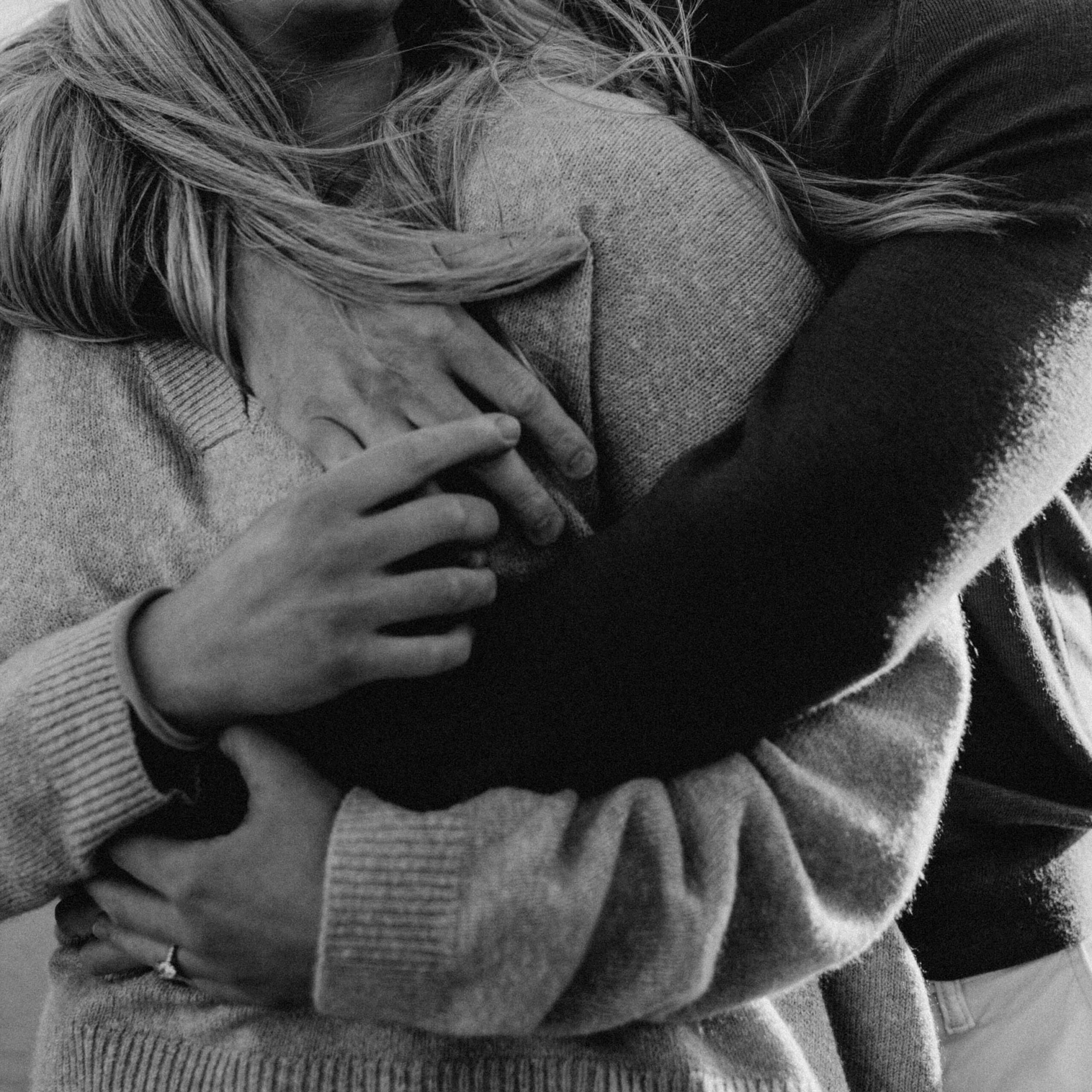 Couple holds each other at an oregon coast engagement photo session