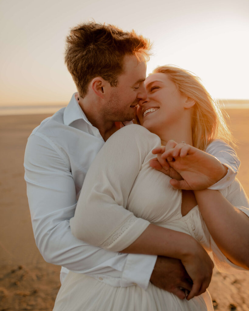 Couple dances on the beach for an oregon coast engagement session