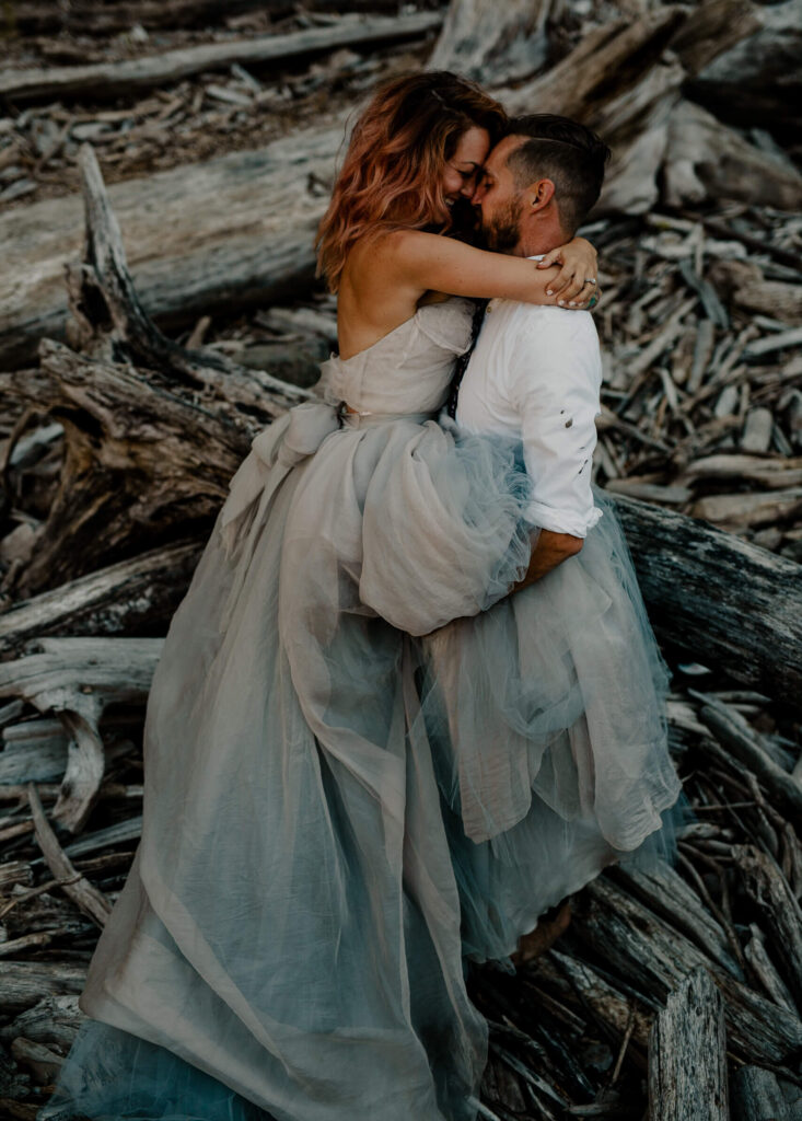 Couple hugs at an elopement at snoqualmie falls