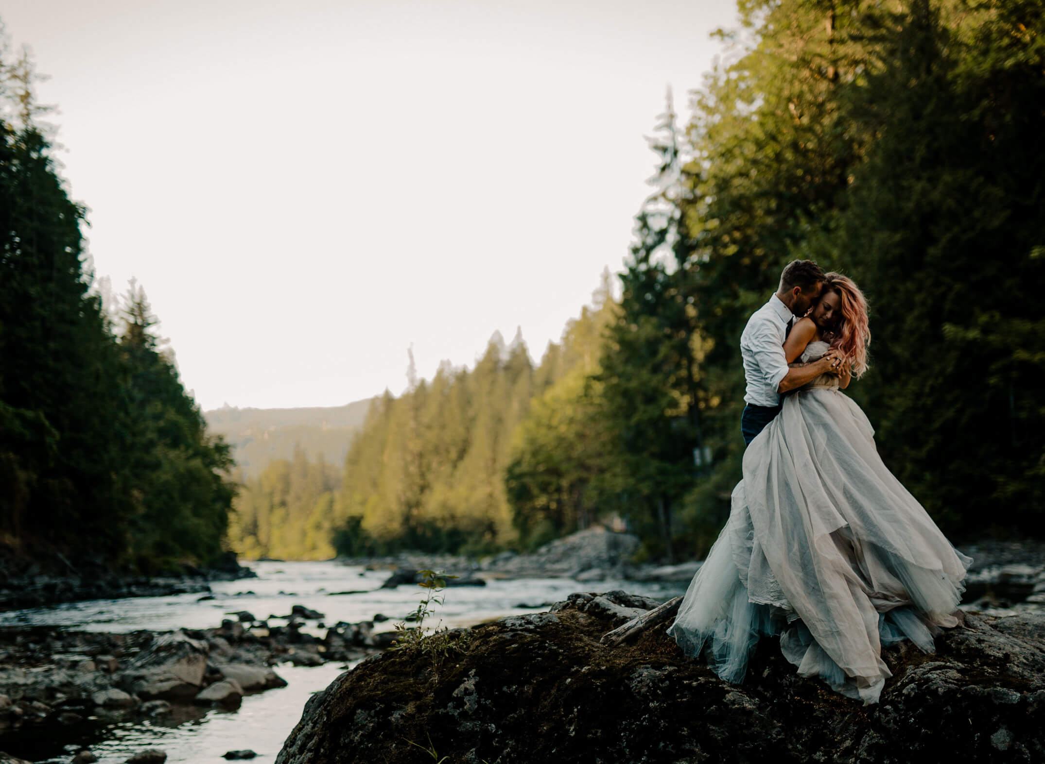 A couple elopes at the base of snoqualmie falls