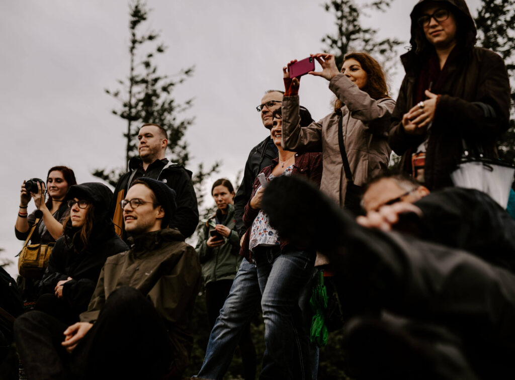 Crowd watches the bride and groom at a Washington Elopement on Rattlesnake Ledge