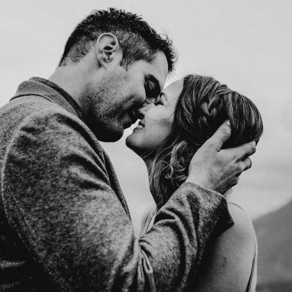 Couple exchange the first kiss at a Washington Elopement on Rattlesnake Ledge