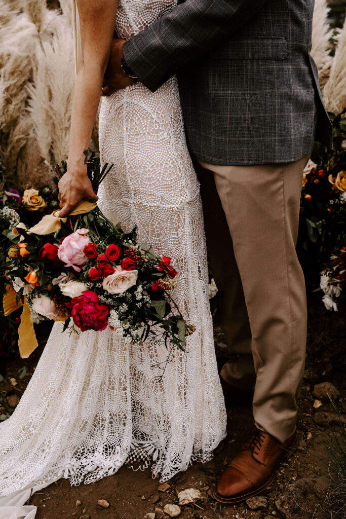 Bride and groom embrace at a smith rock elopement