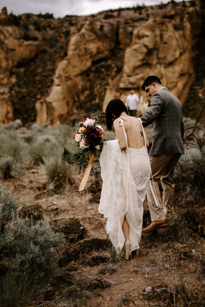 Couple walks away after eloping at smith rock in oregon