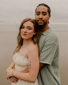 Couple on the beach at an Oregon coast engagement session shot by Ronny and Rene.