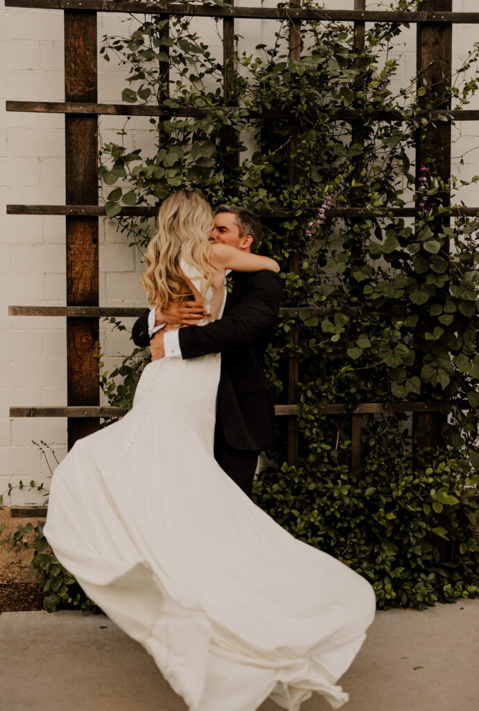 Couple embraces in a spinning hug at an oregon wedding.