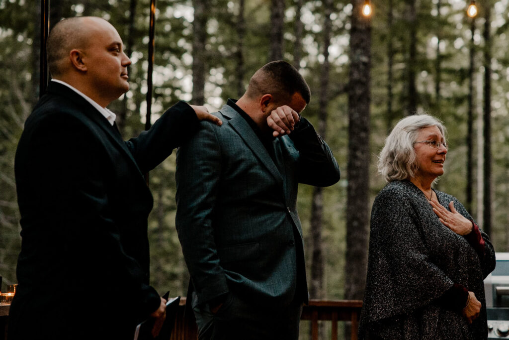 A groom cries after seeing his bride walk down the aisle