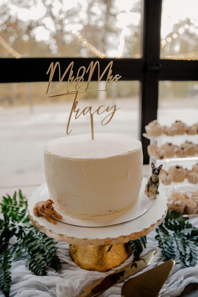 wedding cake and decorations at sage and social reception