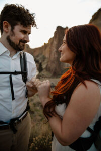 couple pinky promise engagement photoshoot at smith rock
