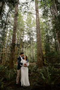 wedding couple hugging in olympic national park forest