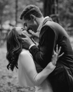 wedding couple face to face smiling in olympic national park forest