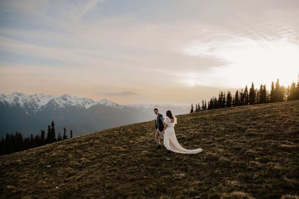 elopement couple at olympic national park mountain side view with sunset behind
