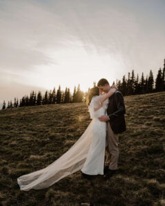 elopement couple at olympic national park hills sunset behind