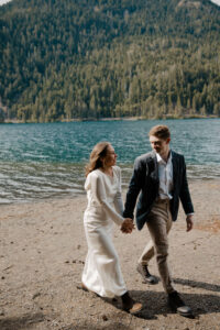 elopement couple at olympic national park lake holding hands