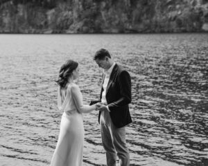 elopement couple at olympic national park lake reciting vows