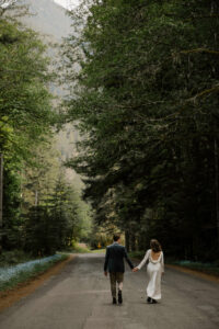 elopement couple at olympic national park road holding hands