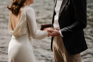 closeup of elopement couple at olympic national park lake reciting vows