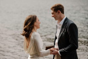 elopement couple at olympic national park lake reciting vows