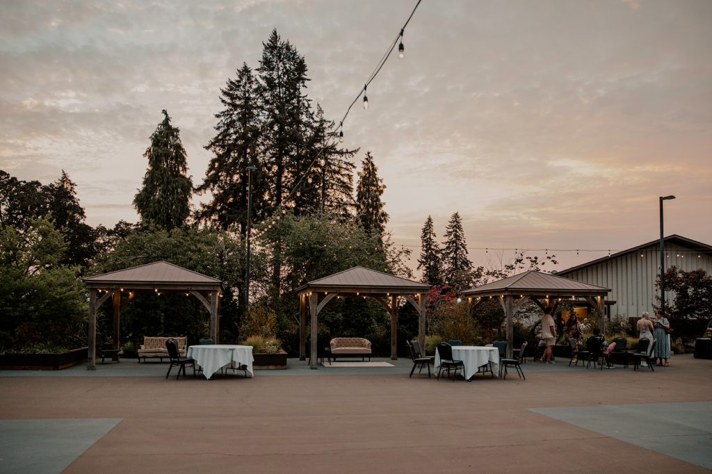 outdoor patio for wedding receptions with gazebos and string lights at the corvallis club in oregon