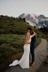 bride and groom kiss on mount rainier hike after eloping