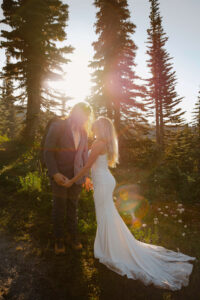 couple looks at each other in mount rainier nature after their elopement golden hour