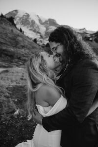 couple smiles nose to nose on hike at mount rainier elopement