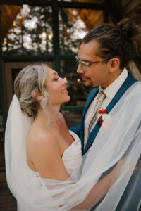 elopement couple looks into each other's eyes lovingly at mount rainier cabin