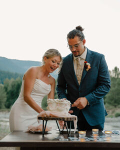 couple cutting cake at mount rainier elopement