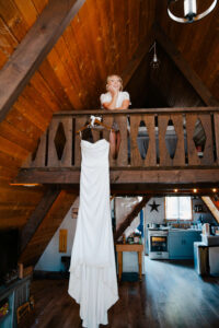 the bride and her dress inside her cabin for her mount rainier elopement