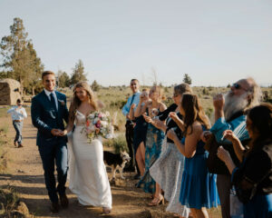 Wedding party cheering during Smith Rock elopement celebration.