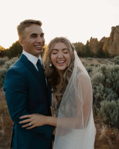 Bride and groom laughing together at Smith Rock State Park