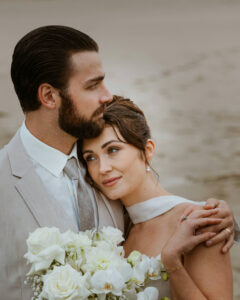 Couple holds each other at their oregon coast vow renewal