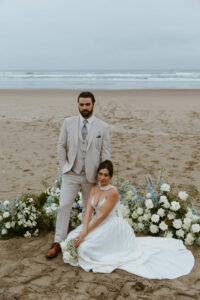 Couple poses for a picture at their oregon coast vow renewal