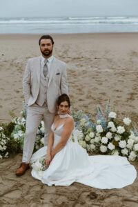 Couple poses for a picture at their oregon coast vow renewal