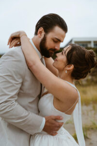 Couple poses for a picture at their oregon coast vow renewal
