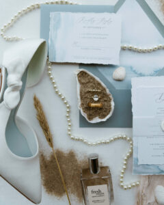 A coastal inspired flat lay for a vow renewal on the oregon coast
