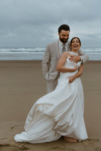 Couple poses for a picture at their oregon coast vow renewal