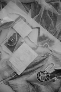 A veil overlay on the invitation suite for an oregon coast vow renewal