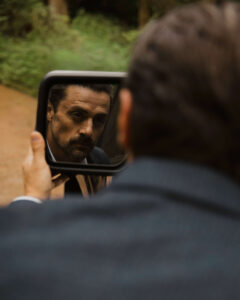 groom uses truck mirror to get ready for a mount rainier elopement